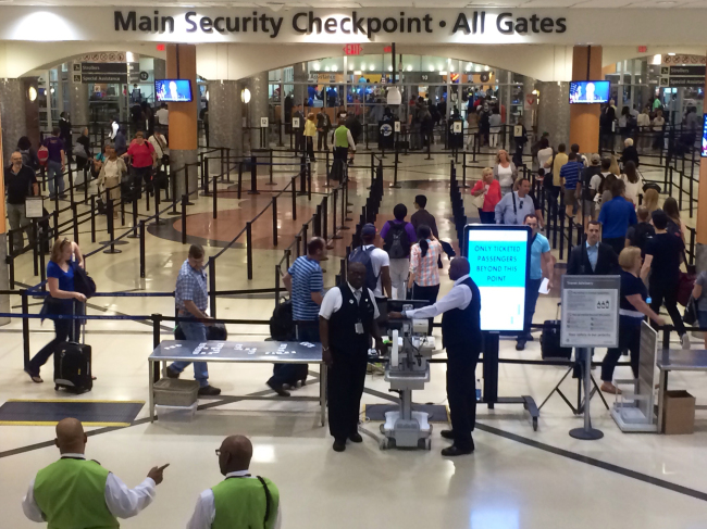 Airline passengers await in line to go through the security checkpoint at Hartsfield-Jackson International Airport in Atlanta, Georgia. (AP)