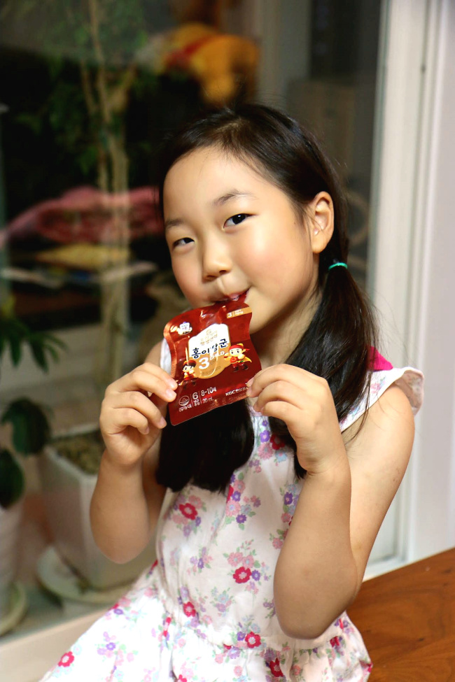 A Korean kid consumes Korean Red Ginseng Kids Tonic. (KGC)