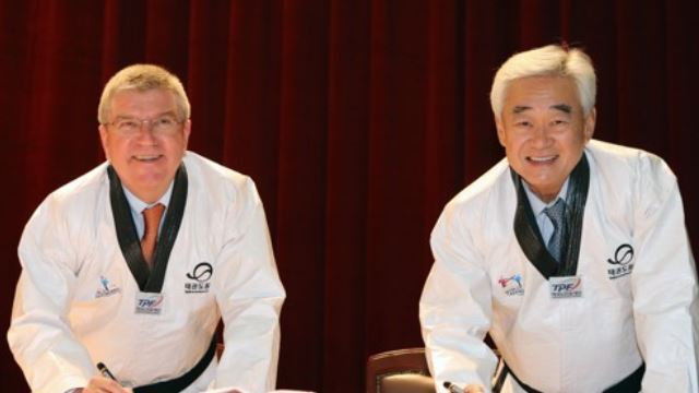 In this file photo taken June 30, 2017, World Taekwondo (WT) President Choue Chung-won (R) poses for a photo with International Olympic Committee President Thomas Bach at Taekwondo Park in Muju, North Jeolla Province. (Yonhap)