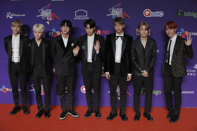 Members of South Korean K-Pop music band BTS pose for photos on the red carpet of the Mnet Asian Music Awards (MAMA) in Hong Kong, Friday. (AP via Yonhap)