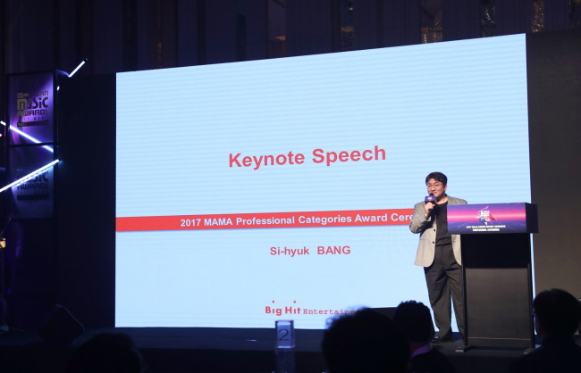 Bang Si-hyuk gives a keynote speech at the Mnet Asian Music Awards at the AsiaWorld-Expo in Hong Kong last Friday. (Big Hit Entertainment)