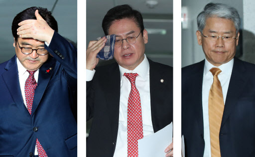 [사진설명=더불어민주당 우원식 원내대표, 자유한국당 정우택 원내대표, 국민의당 김동철 원내대표(왼쪽부터)가 4일 오후 국회 의원회관에서 예산안 처리에 합의한 뒤 합의문 발표를 위해 자리를 이동하고 있다. 사진제공=연합뉴스]
