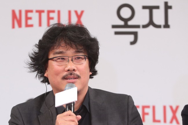 Director Bong Joon-ho speaks at a press conference in Seoul in May. (Yonhap)