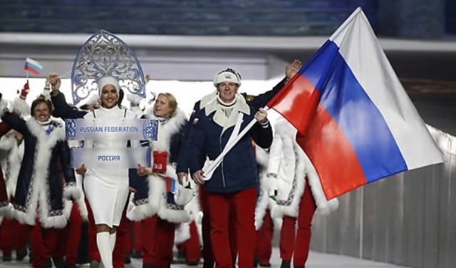 In this Associated Press photo taken Feb. 7, 2014, members of the Russian delegation enter Fisht Olympic Stadium for the opening ceremony of the 2014 Sochi Winter Olympics. The International Olympic Committee banned Russia from the 2018 PyeongChang Winter Olympics over state-sponsored doping on Dec. 5, 2017, allowing only a select few athletes to compete as neutrals if they meet strict conditions. (Yonhap)