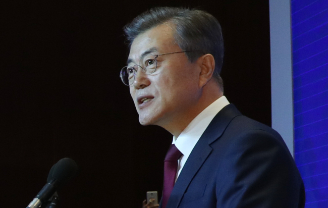 The photo, taken Dec. 14 2017, shows South Korean President Moon Jae-in delivering a speech at the opening of a South Korean-Chinese trade fair in Beijing, China. (Yonhap)