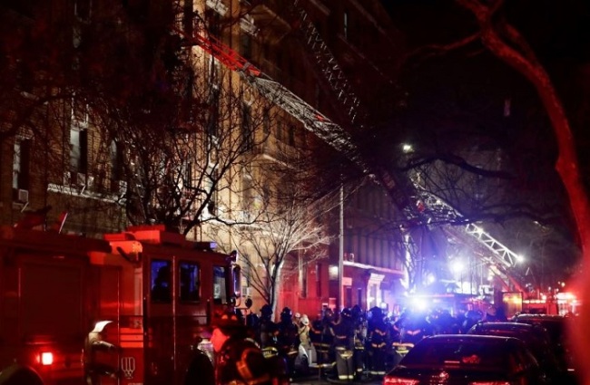 Firefighters respond to a building fire Thursday, Dec. 28, 2017, in the Bronx borough of New York. The Fire Department of New York says a blaze raging in the Bronx apartment building has seriously injured more than a dozen of people. (AP)