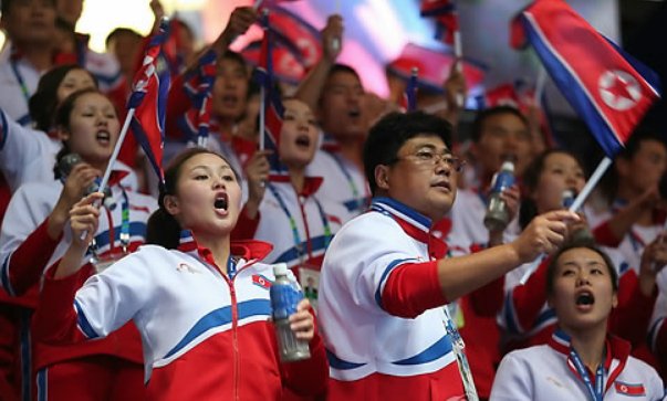 This file photo taken on Sept. 27, 2014, shows North Koreans supporting their athletes in the men's wrestling competition at the Asian Games in Incheon. (Yonhap)