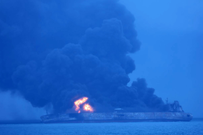 This handout from the Korea Coast Guard taken and released on January 7, 2018 shows the Panamanian-flagged tanker “Sanchi” on fire after a collision with a cargo ship at sea. Thirty-two people, mostly Iranians, were missing on January 7 after an oil tanker collided with a cargo ship off the coast of east China, the transport ministry said. (AFP-Korea Coast Guard)