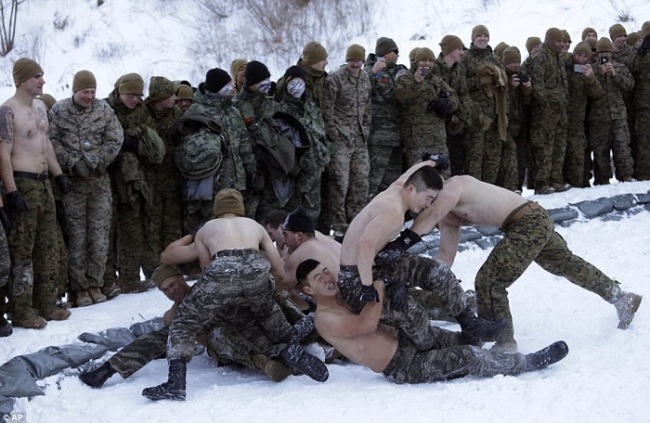 South Korean Marines and US counterparts wrestled topless in the freezing temperatures as part of a team building exercise. (AP)