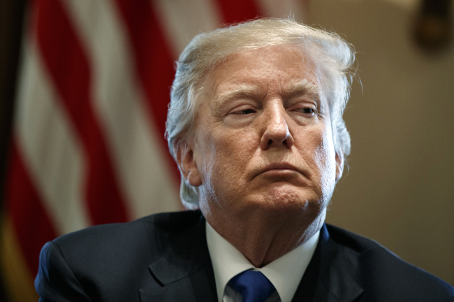 <YONHAP PHOTO-3381> FILE- In this Jan. 9, 2018, file photo, President Donald Trump listens during a meeting with lawmakers on immigration policy in the Cabinet Room of the White House in Washington. Trump used profane language as he questioned Thursday, Jan. 11, why the U.S. should permit immigrants from certain countries as he rejected a plan by a bipartisan group of senators that would have changed rules affecting entrants from Africa and Haiti, according to three people briefed on the conversation. The White House did not deny the comment. (AP Photo/Evan Vucci, File)/2018-01-12 08:29:12/ <저작권자 ⓒ 1980-2018 ㈜연합뉴스. 무단 전재 재배포 금지.>
<YONHAP PHOTO-3381> FILE- In this Jan. 9, 2018, file photo, President Donald Trump listens during a meeting with lawmakers on immigration policy in the Cabinet Room of the White House in Washington. Trump used profane language as he questioned Thursday, Jan. 11, why the U.S. should permit immigrants from certain countries as he rejected a plan by a bipartisan group of senators that would have changed rules affecting entrants from Africa and Haiti, according to three people briefed on the conversation. The White House did not deny the comment. (AP Photo/Evan Vucci, File)/2018-01-12 08:29:12/ <저작권자 ⓒ 1980-2018 ㈜연합뉴스. 무단 전재 재배포 금지.>