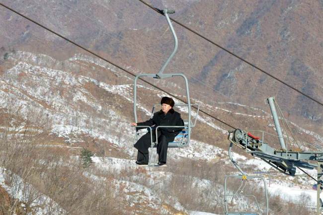North Korean leader Kim Jong-un rides a ski lift at the Masikryong Ski Resort. (Yonhap)