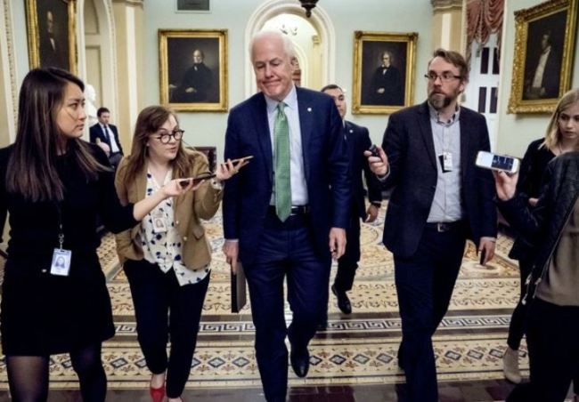 Senate Majority Whip Sen. John Cornyn, R-Texas, speaks to reporters as he walks to the Senate Chamber at the Capitol in Washington, Monday, Jan. 22, 2018, after the Senate reached an agreement to advance a bill ending government shutdown. (AP