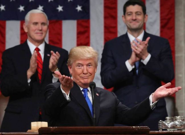 President Donald Trump gestures as delivers his first State of the Union address in the House chamber of the U.S. Capitol to a joint session of Congress Tuesday, Jan. 30, 2018 in Washington, as Vice President Mike Pence and House Speaker Paul Ryan applaud. (AP)
