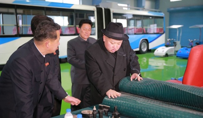 North Korean leader Kim Jong-un tours trolleybus factory in Pyongyang. (Yonhap)