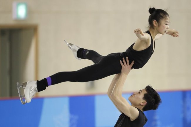North Korea’s Ryom Tae Ok, top, and Kim Ju Sik, perform during a Pairs Figure Skating training session prior to the 2018 Winter Olympics in Gangneung, South Korea, Saturday, Feb. 3, 2018. (AP Photo/Felipe Dana)