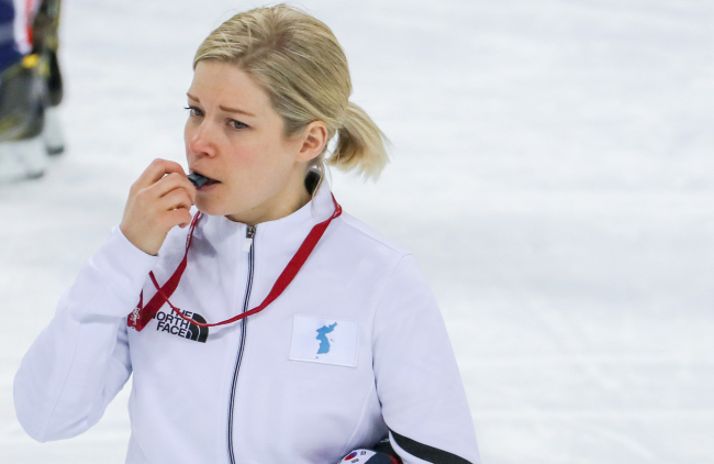 Sarah Murray, head coach of the joint Korean women's hockey team, blows a whistle during practice at Kwandong Hockey Centre in Gangneung, Gangwon Province, on Feb. 7, 2018. (Yonhap)