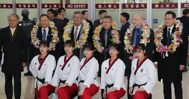 This file photo taken Feb. 7, 2018, shows the North Korean taekwondo demonstration team and officials at Gimpo International Airport in Seoul. (Yonhap)