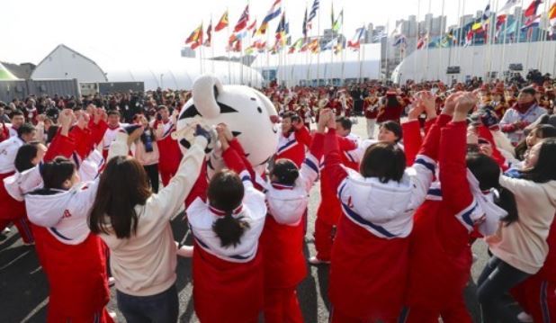North Korean athletes dance at the welcome ceremony in the Gangneung athletes' village on Feb. 8, 2018. (Yonhap)