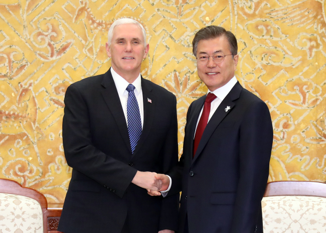 President Moon Jae-in and US Vice President Mike Pence shake hands at the South Korean presidential office on Thursday. Yonhap