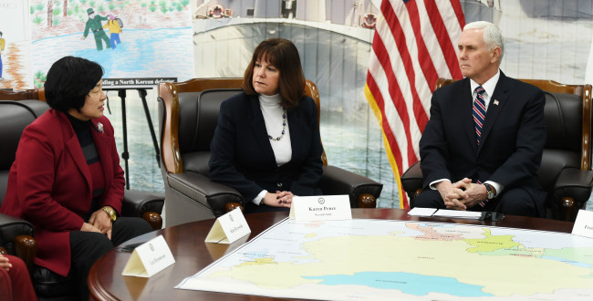 US Vice President Mike Pence meets a North Korean defector on Friday. (Yonhap)