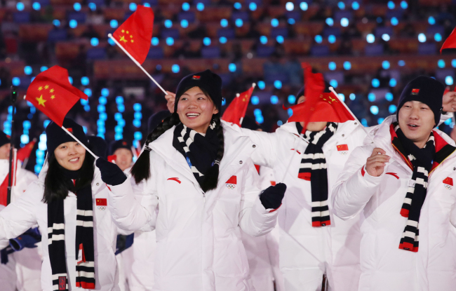 China's athletes enter the PyeongChang Olympic Plaza during the Opening Ceremony of the 2018 Winter Games, Friday. (Yonhap-Reuters)