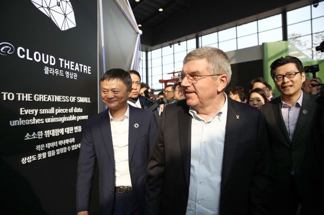 Alibaba Group Chairman Jack Ma (left) and International Olympic Committee President Thomas Bach look around Alibaba Group’s Olympic Games Technology Showcase space at the Gangneung Olympic Park in Gangneung, Gangwon Province, Saturday. (Alibaba)