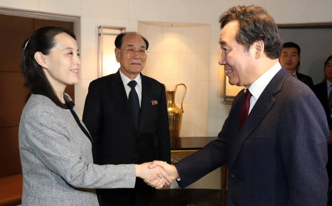 Prime Minister Lee Nak-yon (R) shakes hands with Kim Yo-jong, sister of North Korean leader Kim Jong-un, during a lunch meeting in Seoul on Feb. 11, 2018. (Yonhap)