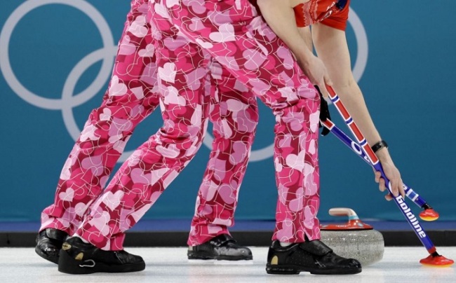 The men’s curling team from Norway wears Valentine’s Day-themed pants for their match Wednesday. (AP)