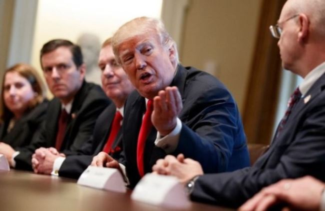 Trump speaks during a meeting with steel and aluminum executives in the Cabinet Room of the White House, Thursday, March 1, in Washington. From left, Beth Ludwig of AK Steel, Roger Newport of AK Steel, John Ferriola of Nucor, Trump, and Dave Burritt of U.S. Steel Corporation. (AP)