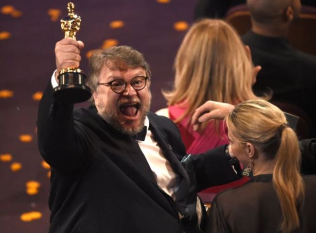 Guillermo del Toro, winner of the award for best director for “The Shape of Water," celebrates in the audience at the Oscars on Sunday, March 4, at the Dolby Theatre in Los Angeles. (AP)