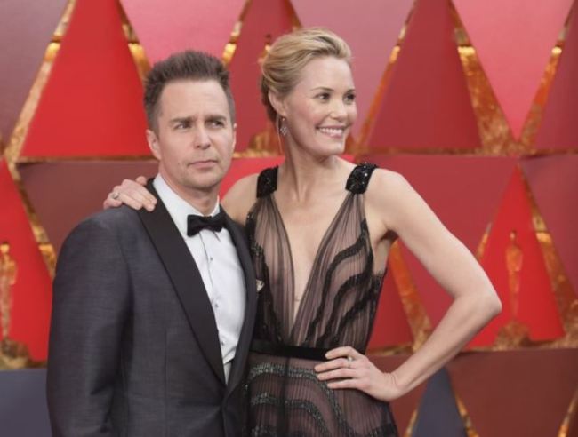 Sam Rockwell, left, and Leslie Bibb arrive at the Oscars on Sunday, March 4, at the Dolby Theatre in Los Angeles. (AP)