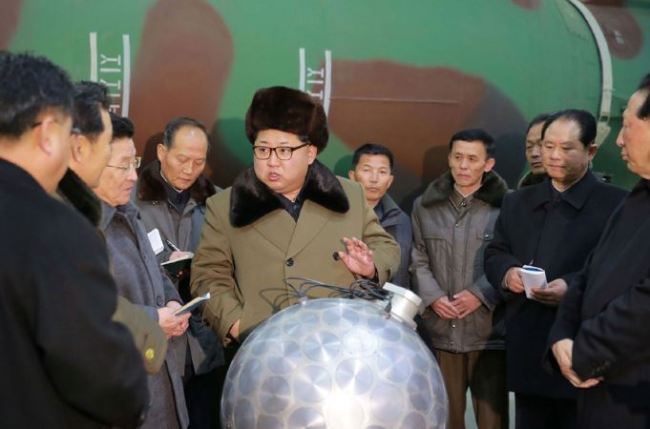 North Korean leader Kim Jong-un describes the development of nuclear warheads in 2016. (Yonhap)