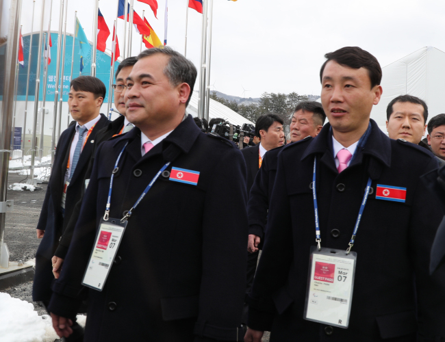 The North Korean delegation to the PyeongChang Winter Paralympics enters the athletes' village in PyeongChang, Gangwon Province, on Wednesday. (Yonhap)