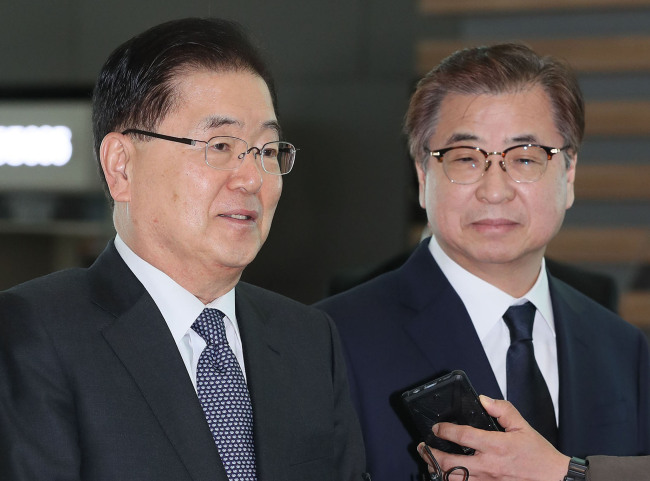 National Security Office chief Chung Eui-yong (left) and National Intelligence Service Director Suh Hoon speak to reporters at the Incheon International Airport on Thursday. Yonhap