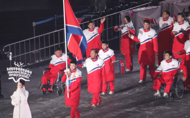 The North Korean team for the PyeongChang Paralympics enters the Olympic Stadium in Gangwon Province at the opening ceremony for the games on Friday. (Yonhap)