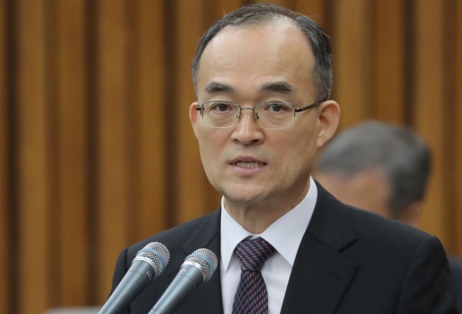 Prosecutor-General Moon Moo-il attends a parliamentary session of a special committee on prosecution reform at the National Assembly on March 13. (Yonhap)