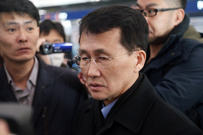 North Korean diplomat Choe Kang-il (center) is spotted at Capital International Airport to check in to a flight to Helsinki in Beijing, China on Sunday. (Yonhap)