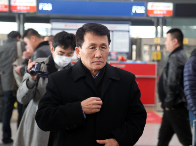 North Korean diplomat Choe Kang-il heads to Helsinki through the Capital International Airport in Beijing, China on Sunday. (Yonhap)