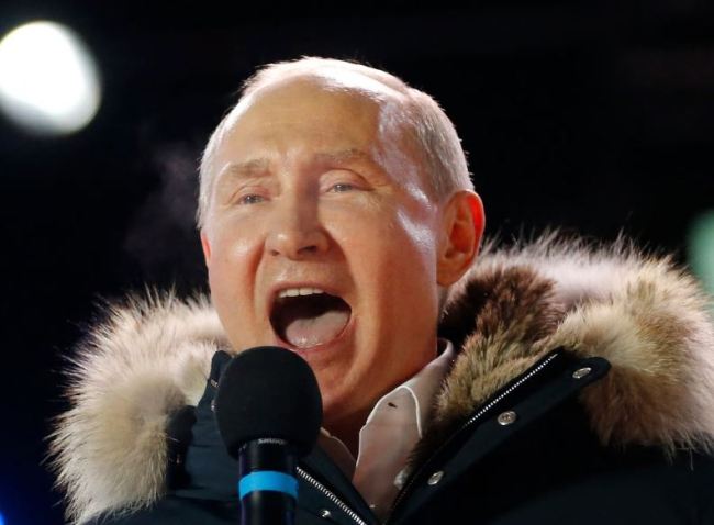 Russian President Vladimir Putin speaks to supporters during a rally near the Kremlin in Moscow, Sunday, March 18. (AP)
