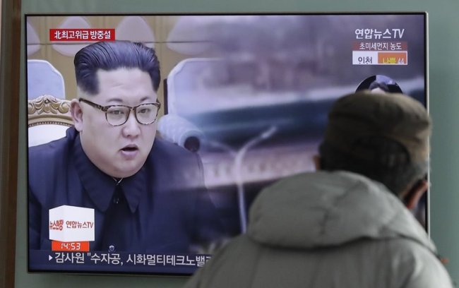 A man watches a TV screen showing file images of North Korean leader Kim Jong Un during a news program at the Seoul Railway Station in Seoul, South Korea, Tuesday, March 27, 2018. (AP