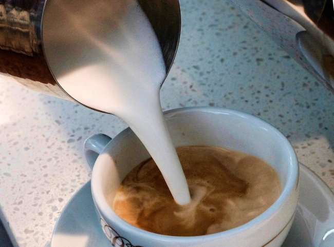 In this Sept. 22, 2017, file photo, a barista pours steamed milk in a coffee at a cafe in Los Angeles. (AP)