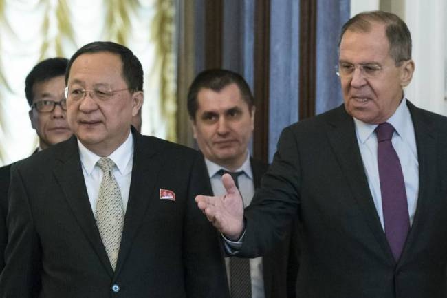 Russian Foreign Minister Sergey Lavrov, right, welcomes North Korean Foreign Minister Ri Yong Ho for the talks during their meeting in Moscow on Tuesday, April 10. (AP)
