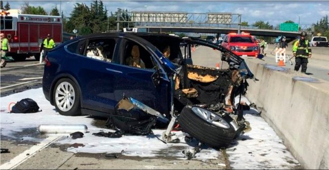 In this March 23 file photo provided by KTVU, emergency personnel work at the scene where a Tesla electric SUV crashed into a barrier on US Highway 101 in Mountain View, California. (AP)