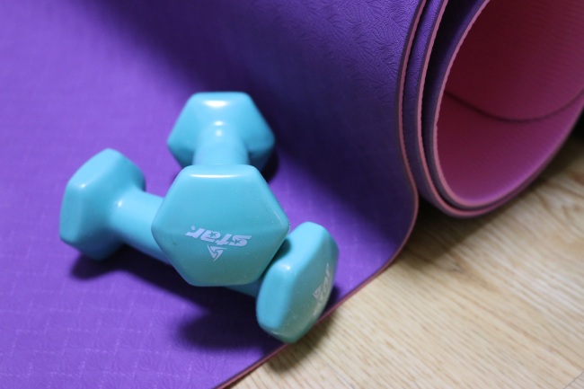 Many home trainers use weights and yoga mats in their workout routines. (Rumy Doo/The Korea Herald)