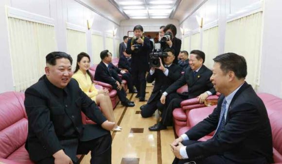 File photo of Kim Jong-un meeting with Chinese senior official Song Tao. (Yonhap)