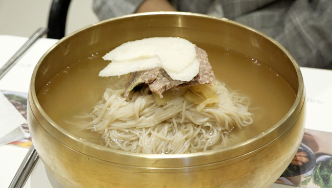 Pyongyang-style naengmyeon served at Bongmilga, a modern Seoul restaurant specializing in high-buckwheat cold noodles in clear beef broth