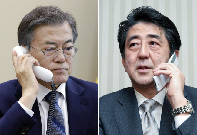 President Moon Jae-in (left) and Japanese Prime Minister Shinzo Abe. Yonhap