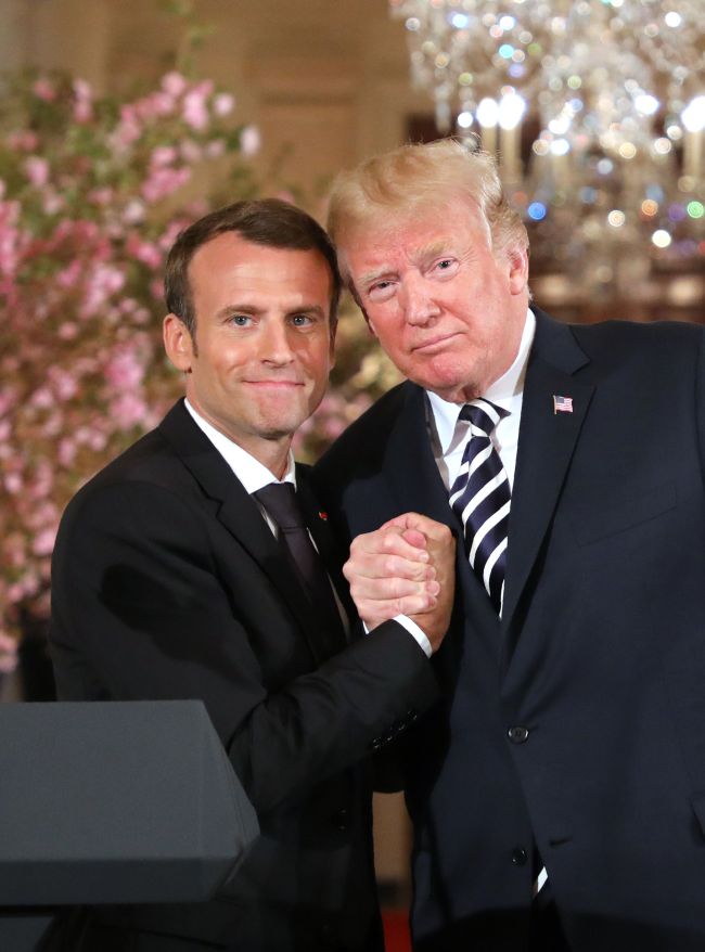 US President Donald Trump and French President Emmanuel Macron skahe hands during a joint press conference at the White House in Washington, DC, on April 24, 2018. (AFP-Yonhap)