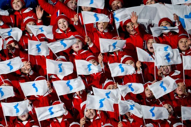 North Korean cheerleaders wave the unified flag of the two Koreas at the opening ceremony of the PyeongChang Winter Olympics in PyeongChang, Gangwon Province, in February. (Yonhap)