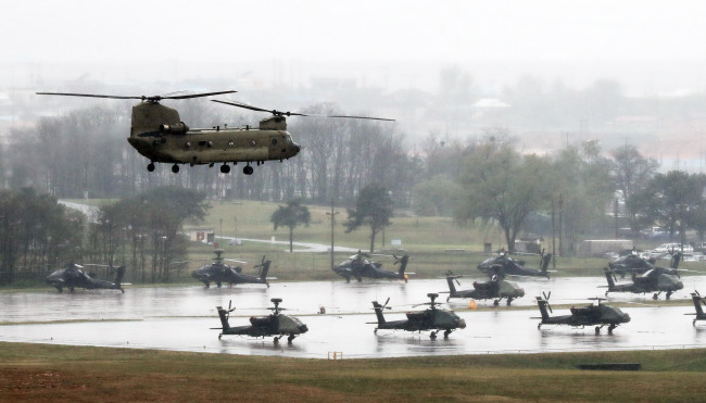 CH-47 Chinook chopper flies over US Army garrison Camp Humphrey Thursday. Yonhap